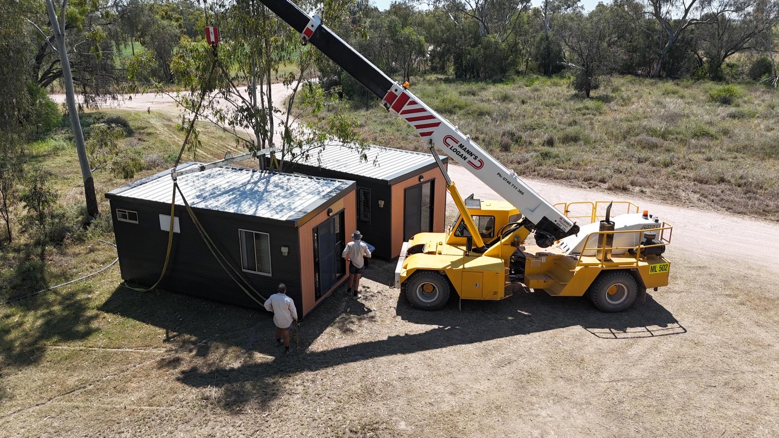 Portable workforce accommodation being installed by crane on a regional project