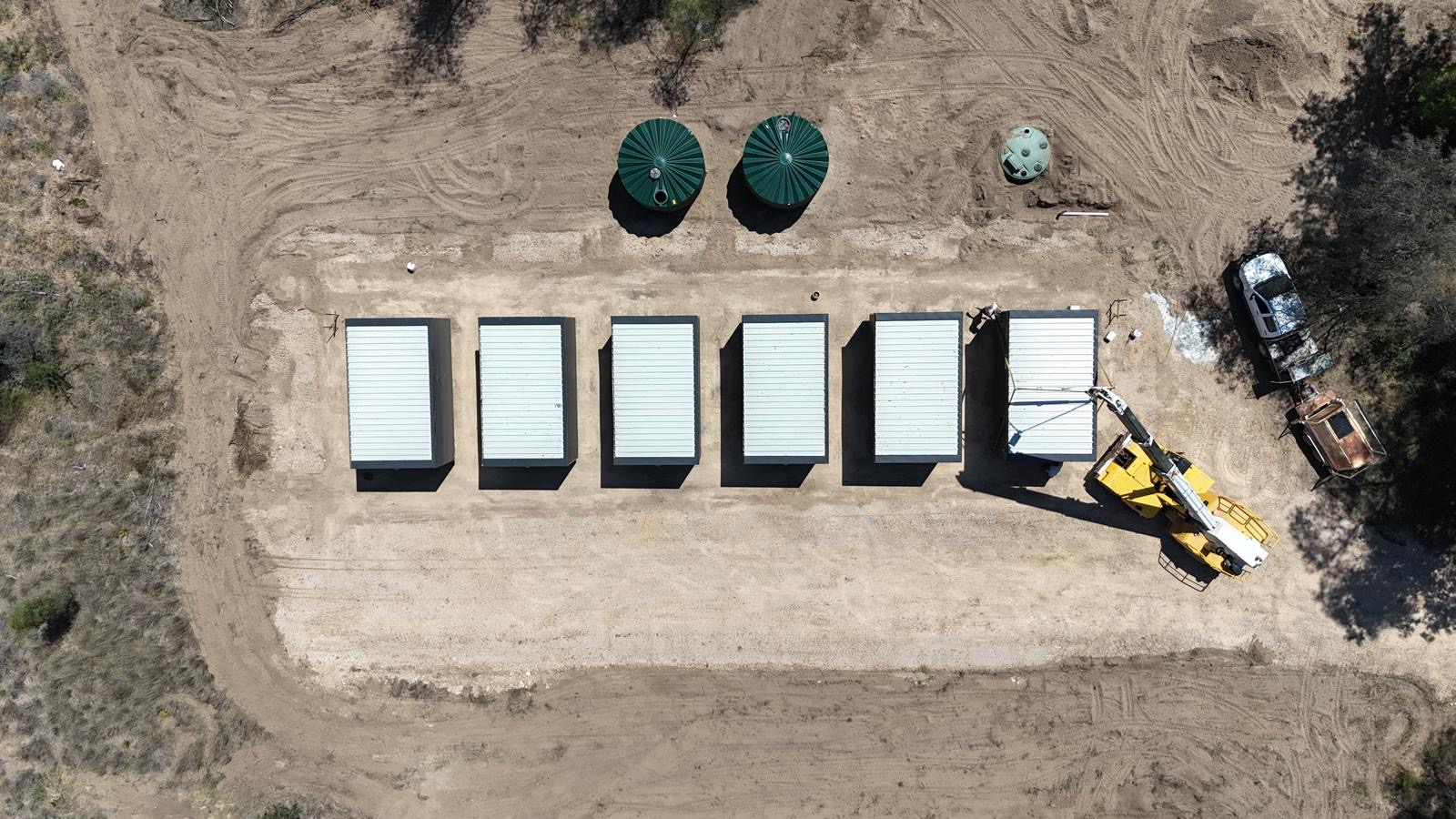 Top-down aerial view of six worker accommodation units